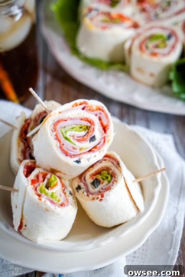 Crisp Turkey Apple Swiss Wraps 4 A white bowl with several Italian Pinwheels stacked inside.
