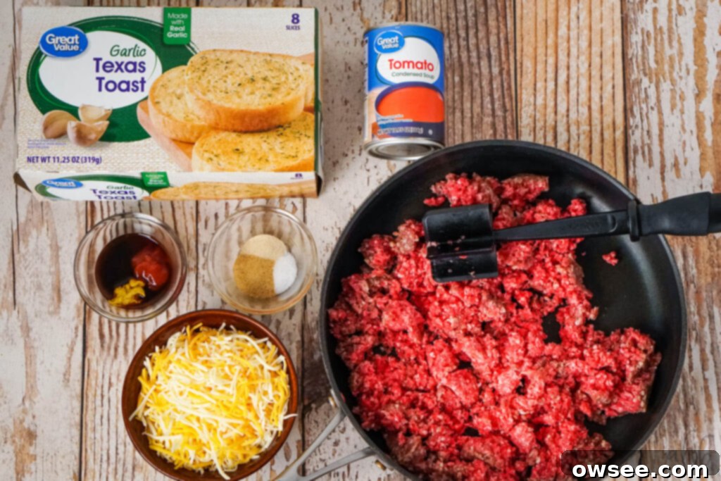 Sloppy Joe Stuffed Garlic Bread 5 A collection of ingredients for Garlic Bread Sloppy Joes, including ground beef, tomato soup, sauces, spices, garlic bread, and cheese.