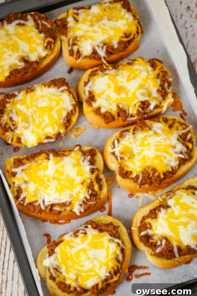 Sloppy Joe Stuffed Garlic Bread 9 A baking tray of finished Garlic Bread Sloppy Joes topped with perfectly melted Colby Jack cheese, ready to serve.