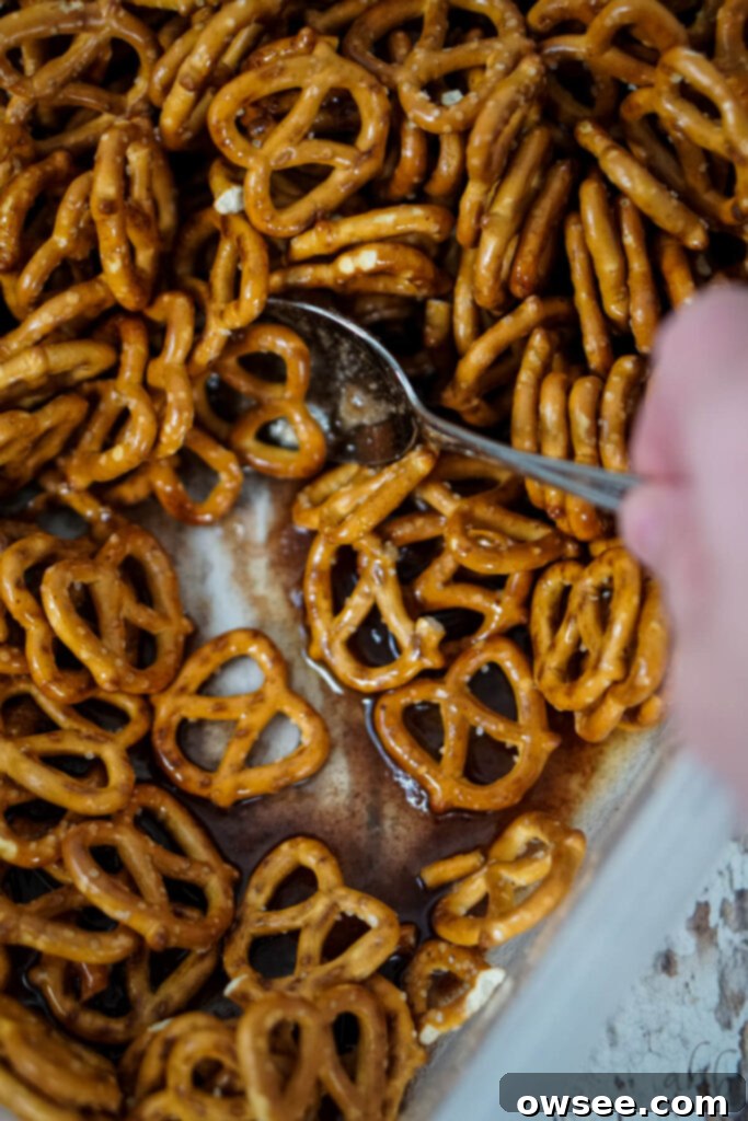 Sweet Cinnamon Twists 5 Pretzels are mixed into the melted butter, sugar, corn syrup, and cinnamon with a spoon.