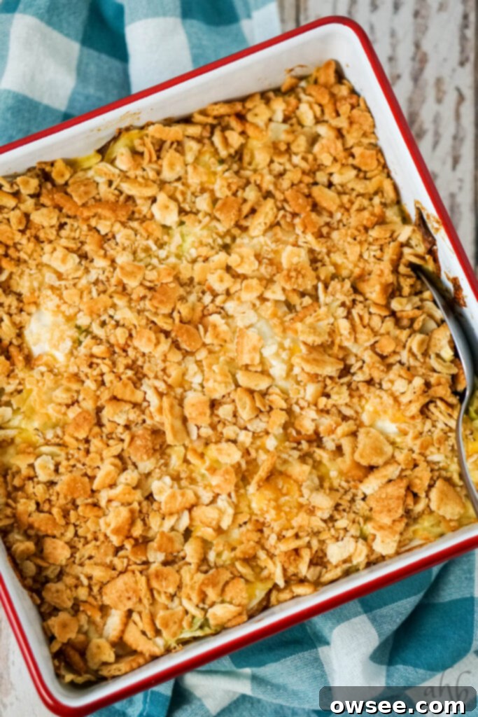 Creamy Cabbage Bake 7 A baked Scalloped Cabbage Casserole is about to be scooped out of the pan.