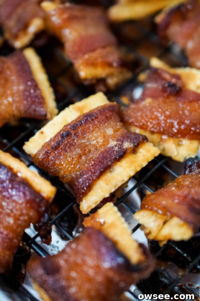 Sweet Heat Bacon Crisps 7 A batch of freshly baked Cajun Candied Bacon Crackers, with a rich, caramelized glaze, cooling on a wire rack.