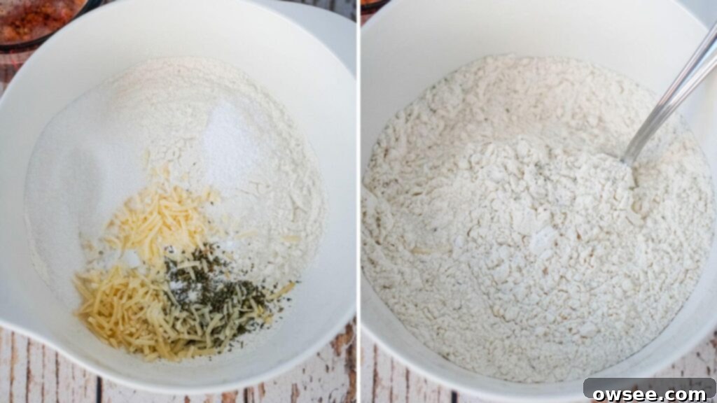 Sun-Kissed Tomato Parmesan Beer Bread 7 A close-up view of a mixing bowl containing all-purpose flour, minced garlic, Italian seasoning, two tablespoons of Parmesan cheese, sugar, baking powder, and salt, ready to be combined.