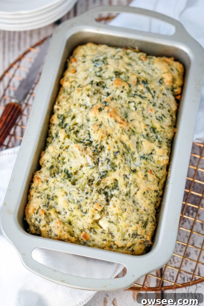 Savory Spinach Feta Beer Bread 2 A loaf of Spinach Feta Bread cooling in the bread pan on a wire rack.