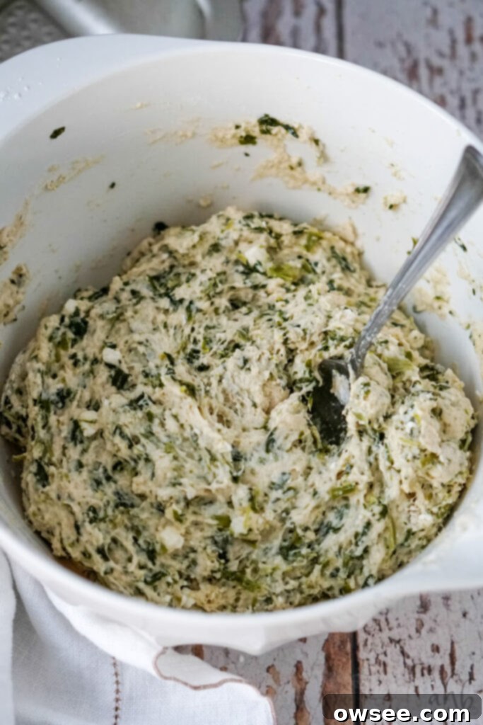 Savory Spinach Feta Beer Bread 8 The ingredients are mixed together with a fork until they become a dough-like consistency.