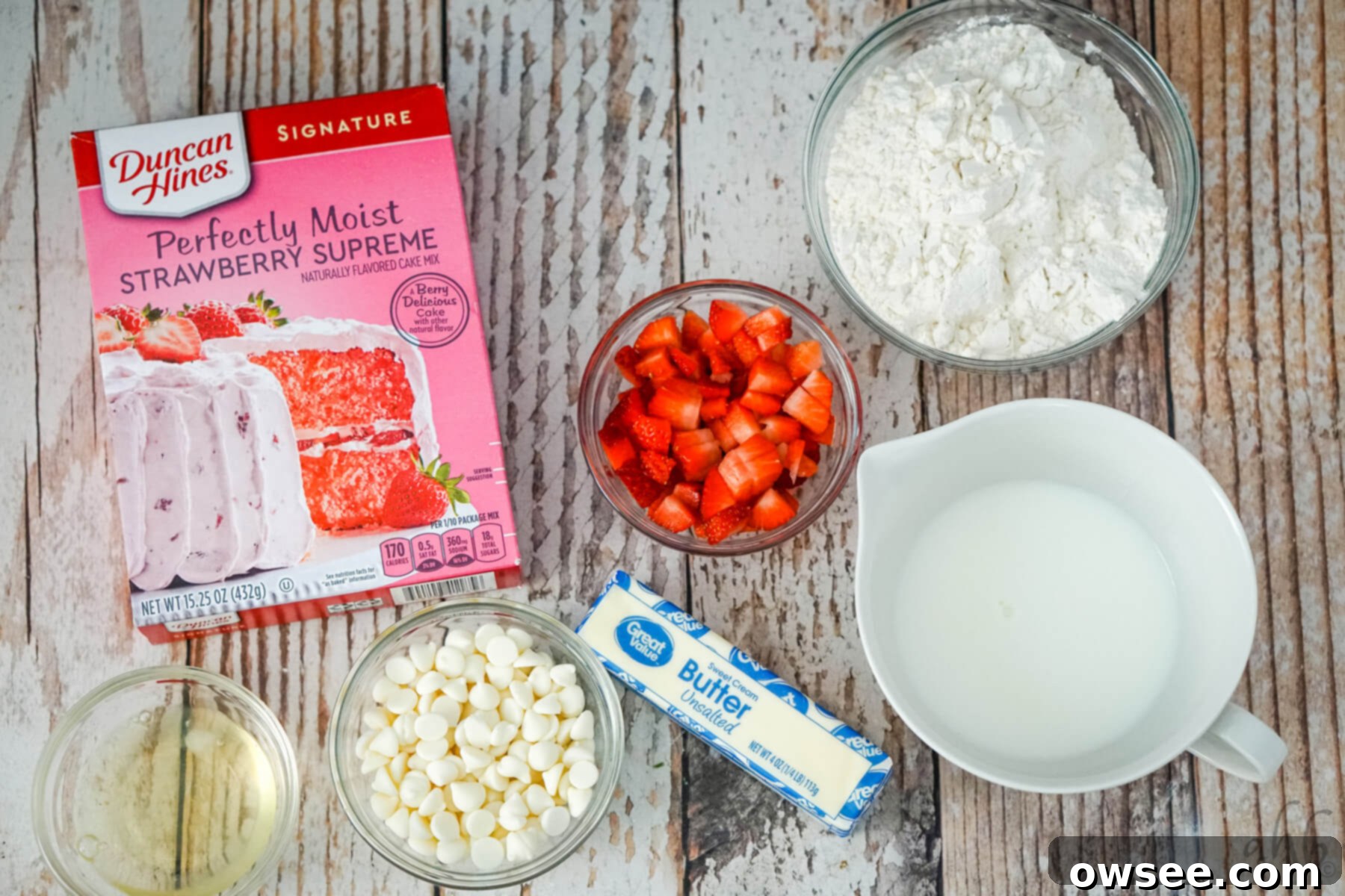 Sweet Strawberry Shortcut Scones 4 The ingredients needed to make strawberry cake mix scones: strawberry cake mix, chopped strawberries, flour, egg white, white chocolate chips, butter, and milk.