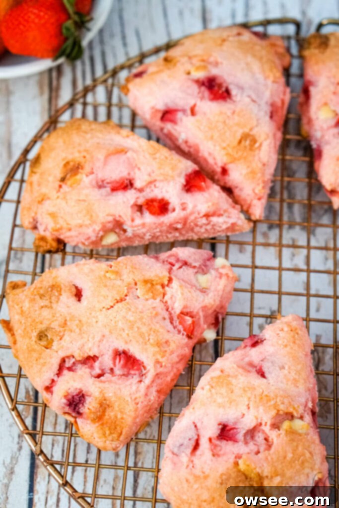 Sweet Strawberry Shortcut Scones 9 Strawberry cake mix scones cooling on a wire rack.
