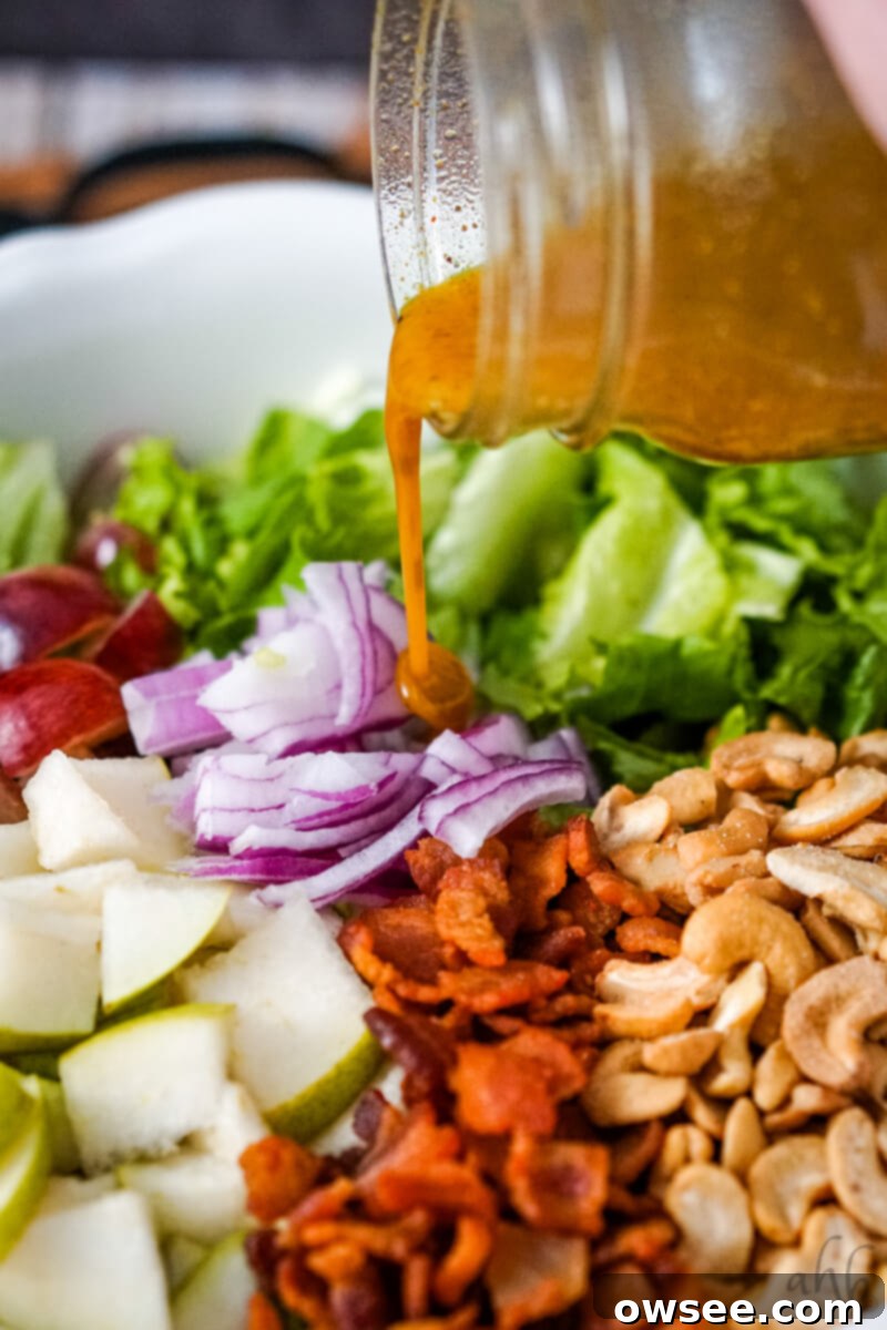Cashew Salad 9 The vinaigrette is poured over the salad.