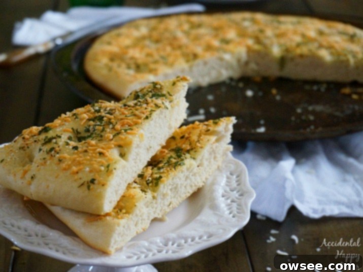Cheesy Garlic Focaccia 3 Homemade Garlic Cheese Focaccia Bread, golden brown and ready to serve.