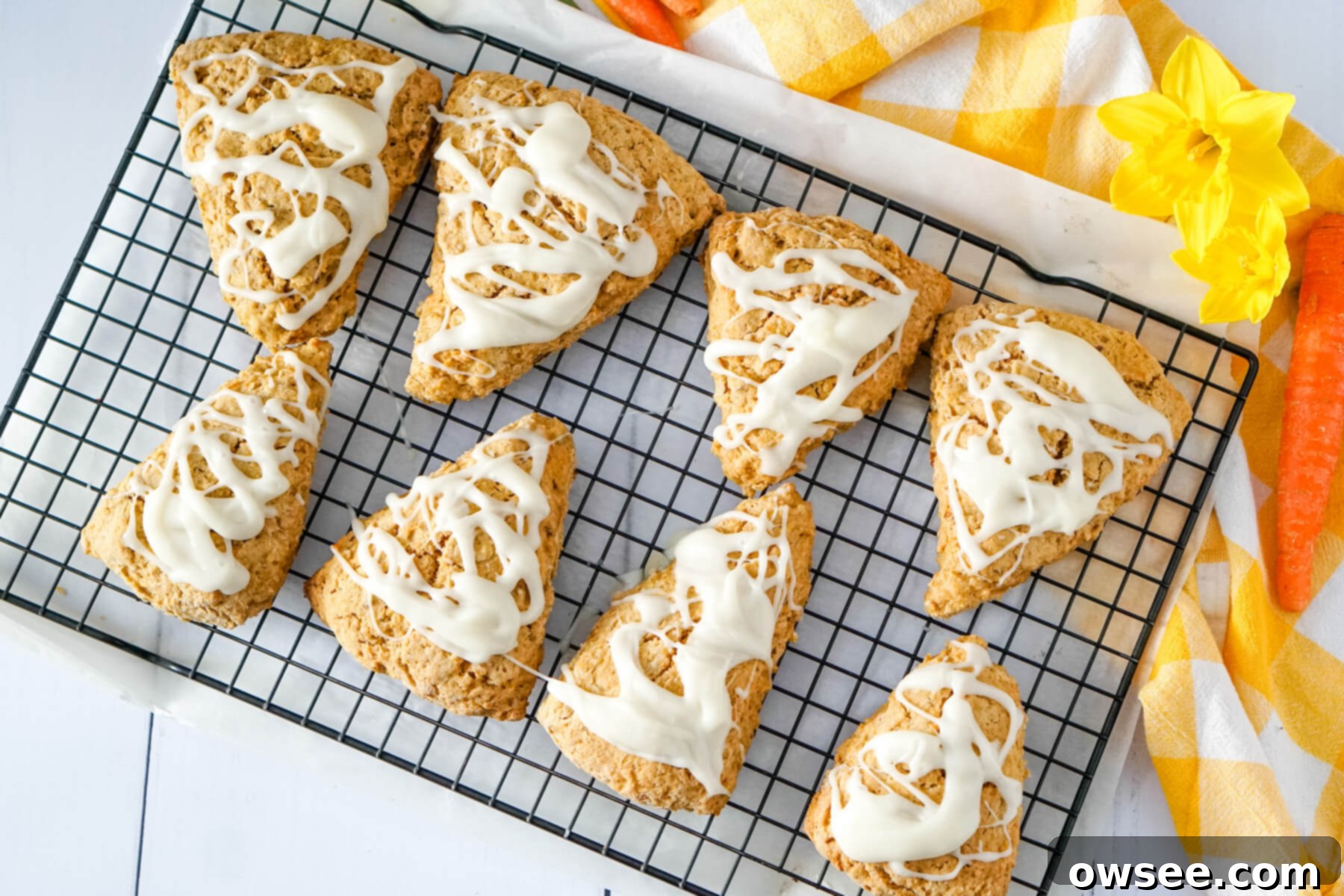 Effortless Carrot Cake Scones 9 The scones are cooled on the wire rack and are covered with the glaze.