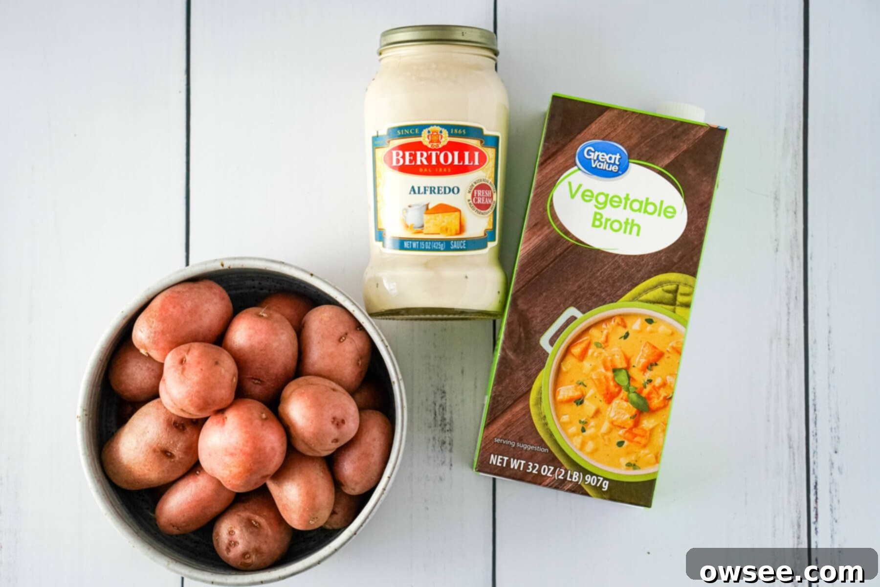 Unbelievably Easy 3 Ingredient Potato Soup 4 A bowl of baby red potatoes, Bertolli Alfredo sauce, and vegetable broth.