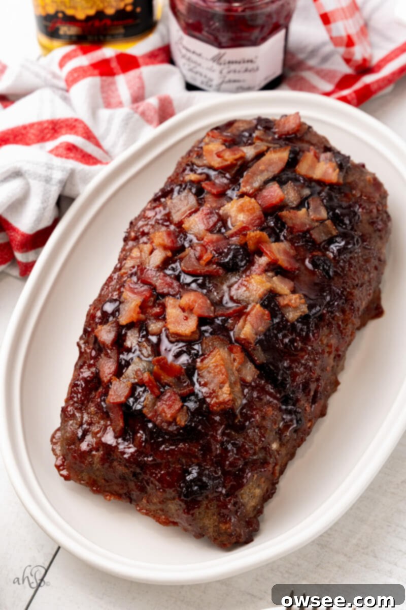 Ultimate Bourbon Bacon Meatloaf 7 A delicious slice of Bourbon Bacon Meatloaf ready to be served.