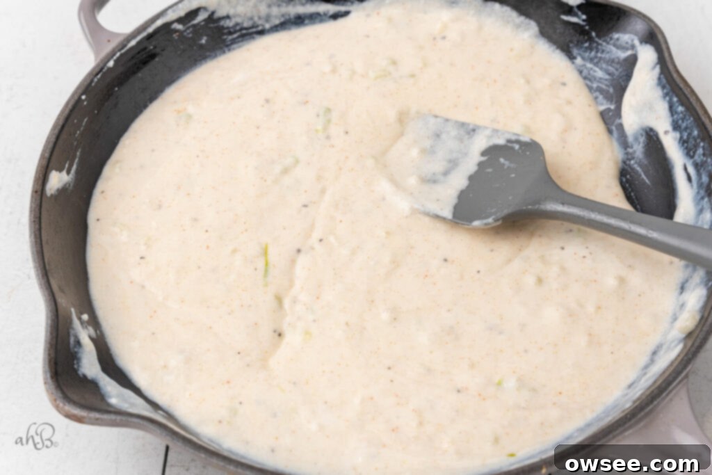 Creamy Tang Pasta 9 The sour cream has been stirred into the skillet with the spatula.
