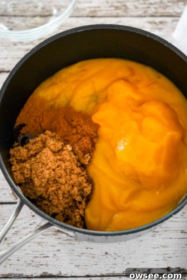 Pumpkin butter mixture simmering in a saucepan