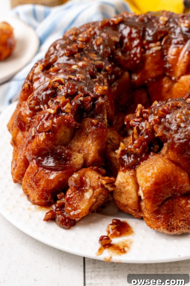 Gooey Caramel Banana Pull-Apart Bread 3 A chunk has been pulled away from the Bananas Foster Monkey Bread, revealing its soft, sticky interior.
