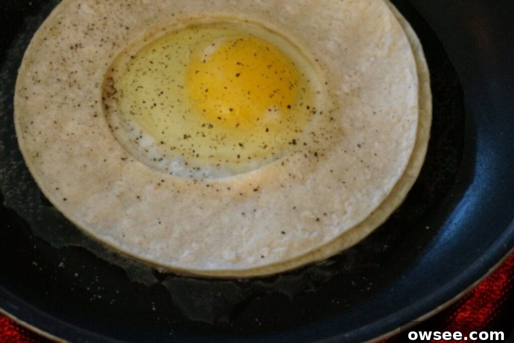 Mexican Huevo in a Hole 6 In a skillet, the tortillas and egg are fried together in oil.