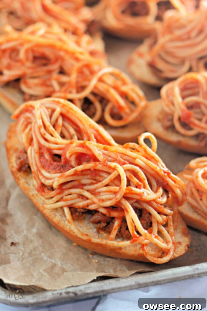 Quick Spaghetti Bread 5 Meat sauce and spaghetti are added to the garlic bread.