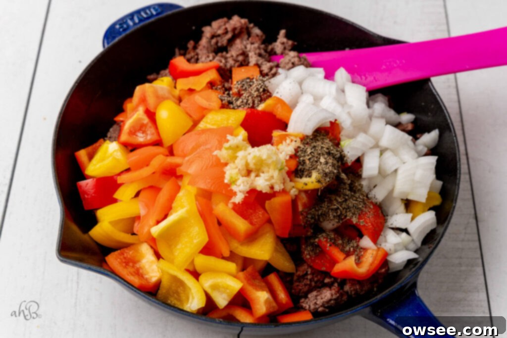 One-Pan Pizza Pepper Skillet 6 The onion, pepper, minced garlic, basil, and ground pepper to the pan.