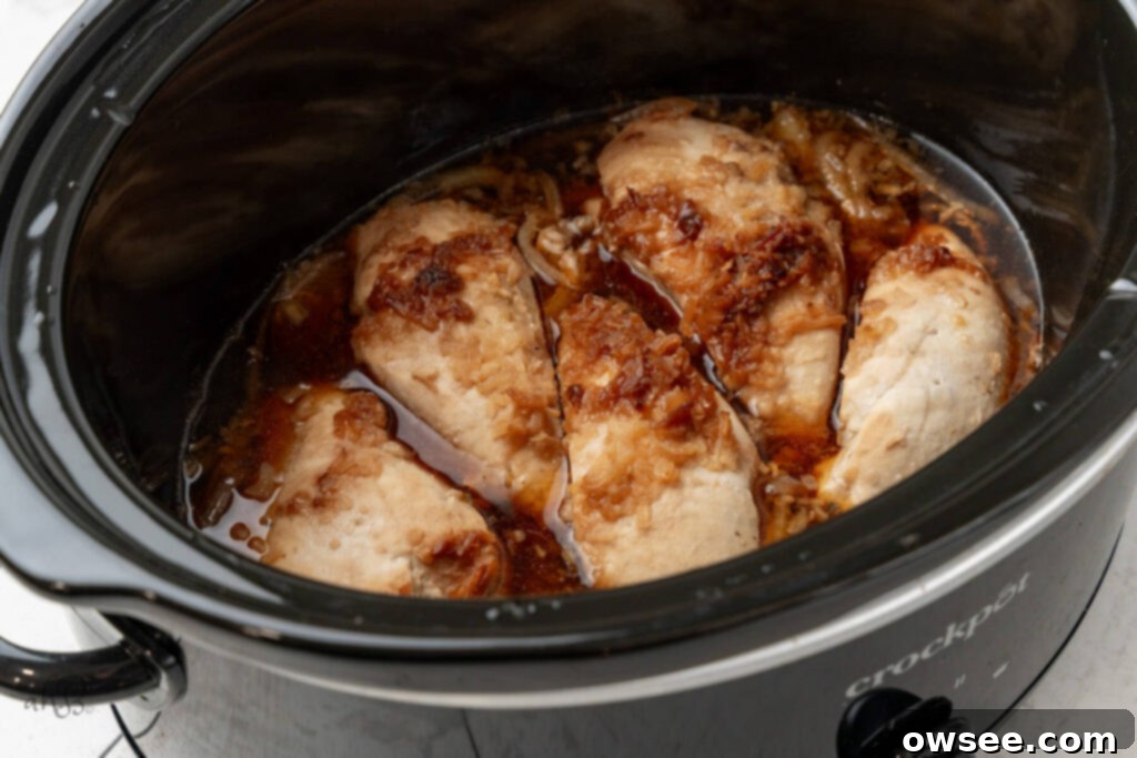 Slow Cooker French Onion Chicken 7 The chicken is cooked in the crockpot.
