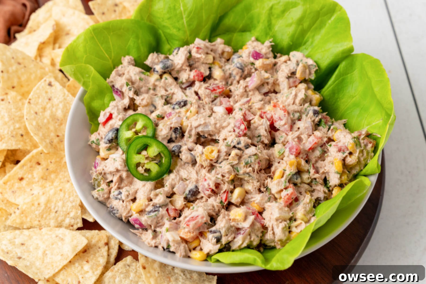 Vibrant Mexican Tuna Medley 9 A vibrant bowl of Mexican Tuna Salad, garnished with fresh jalapeños and ready to be enjoyed.