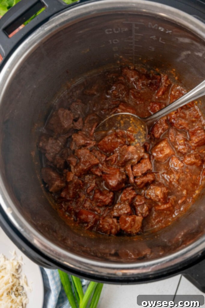 Tender Instant Pot Korean Beef 7 The sauce and cubed beef have been cooked together in the instant pot.