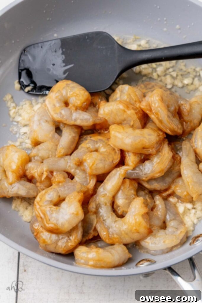 Honey Garlic Glazed Shrimp 9 Pour the shrimp and the cornstarch slurry into the pan and cook for one minute on each side.