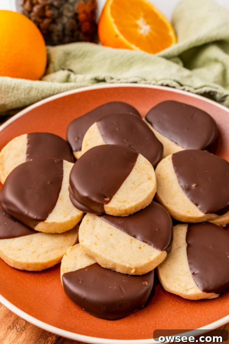 Decadent Orange Chocolate Shortbread 3 A red plate full of chocolate Orange Shortbread Cookies.