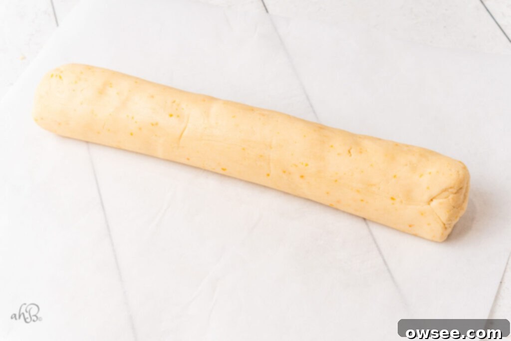 Decadent Orange Chocolate Shortbread 9 The dough is shaped into a log on parchment paper.