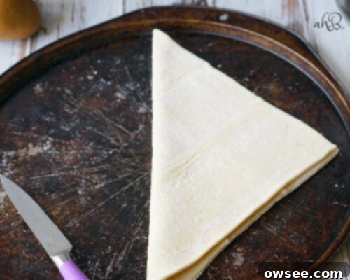 Puff pastry dough being scored for a galette crust