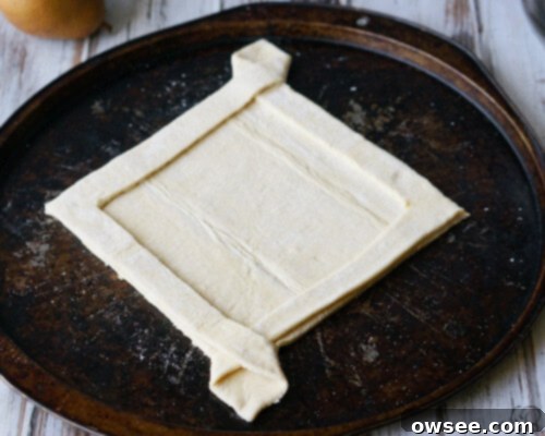 Arranging fruit on a galette crust