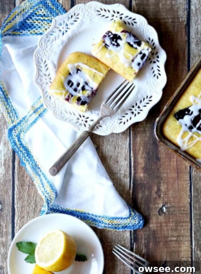 Lemon Poppy Seed Blueberry Squares arranged elegantly on a serving platter, ready to be enjoyed.