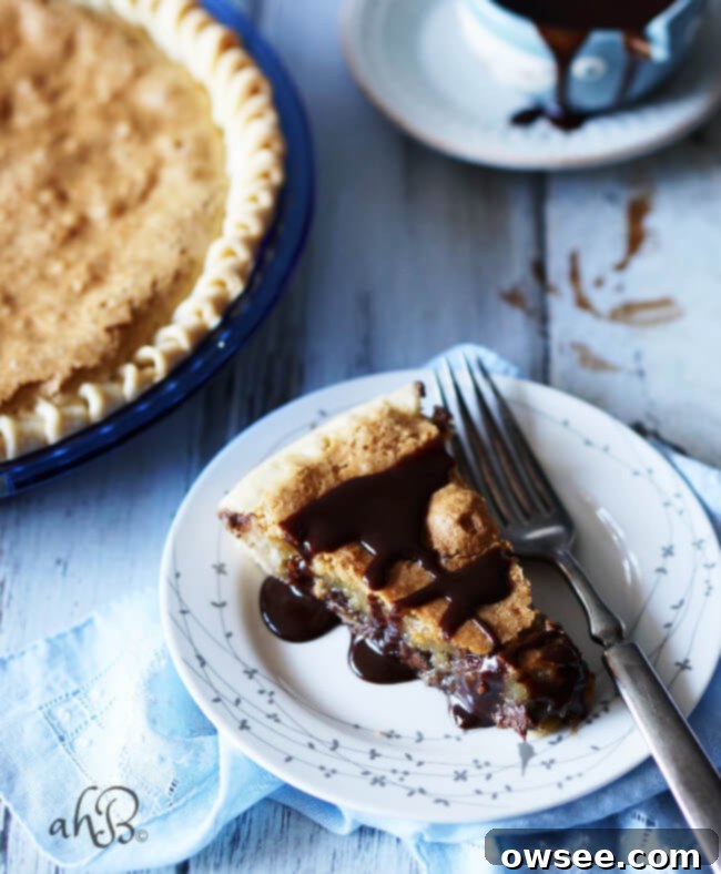 Golden Cookie Pie 2 Warm Chocolate Chip Cookie Pie slice served with ice cream, ready to be enjoyed
