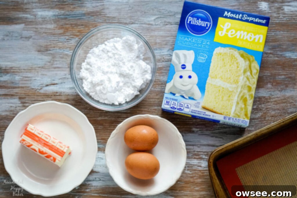 Zesty Lemon Crinkle Cookies 4 The ingredients needed for the recipe: butter, powdered sugar, eggs, and a box of lemon cake mix.