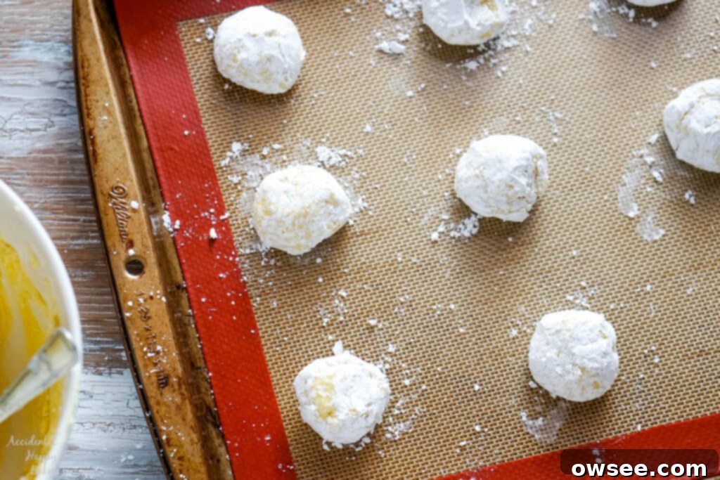 Zesty Lemon Crinkle Cookies 7 Step 3, placing the cookies two inches apart on cookie sheets and baking the lemon crinkle cookies.