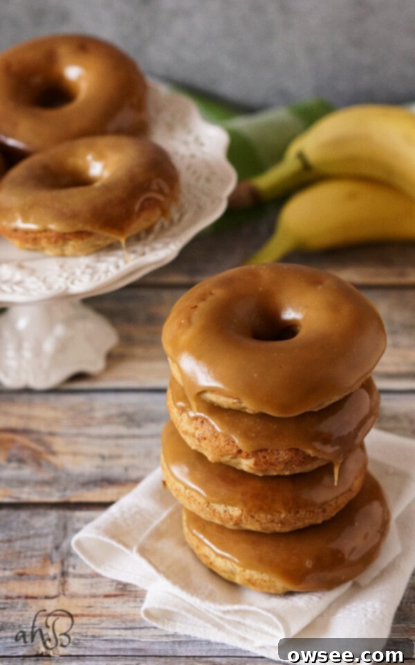 Moist banana bread-like donut dipped in a gorgeous buttery dark caramel glaze that sets up so pretty, with a pinch of salt to even out the sweetness. Recipe on www.accidentalhappybaker.com @AHBamy