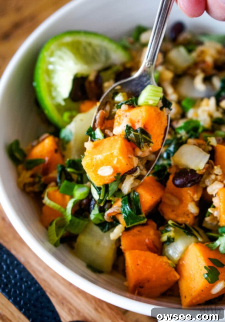 Sweet Potato Bowls with Sweet Chili 2 A vibrant bowl of Sweet Potato Sweet Chili Bowls, topped with fresh green onions and cilantro.