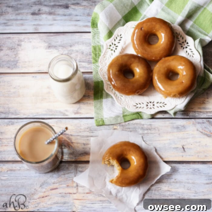 Moist banana bread-like donut dipped in a gorgeous buttery dark caramel glaze that sets up so pretty, with a pinch of salt to even out the sweetness. Recipe on www.accidentalhappybaker.com @AHBamy