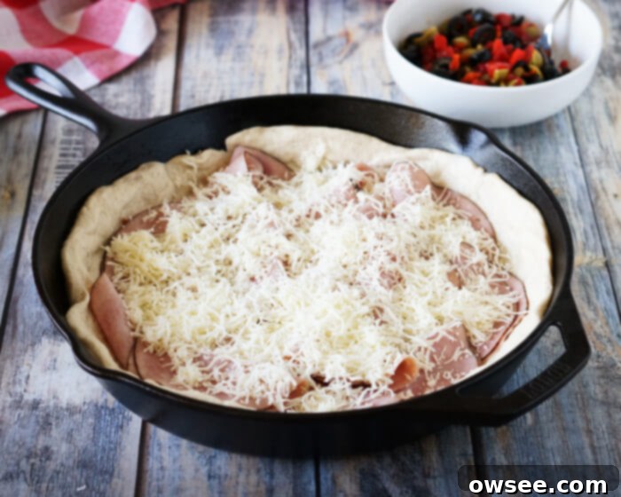 Baked Muffaletta 7 Adding Shredded Cheese to Baked Muffaletta Layers