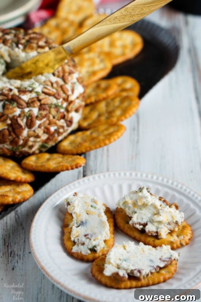 Blue Cheese Cheese Ball on a serving platter with various crackers and grapes