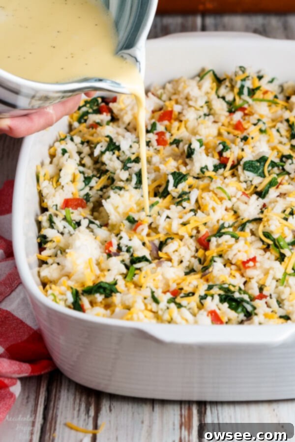 A scoop of Spinach Rice Casserole served from the baking dish