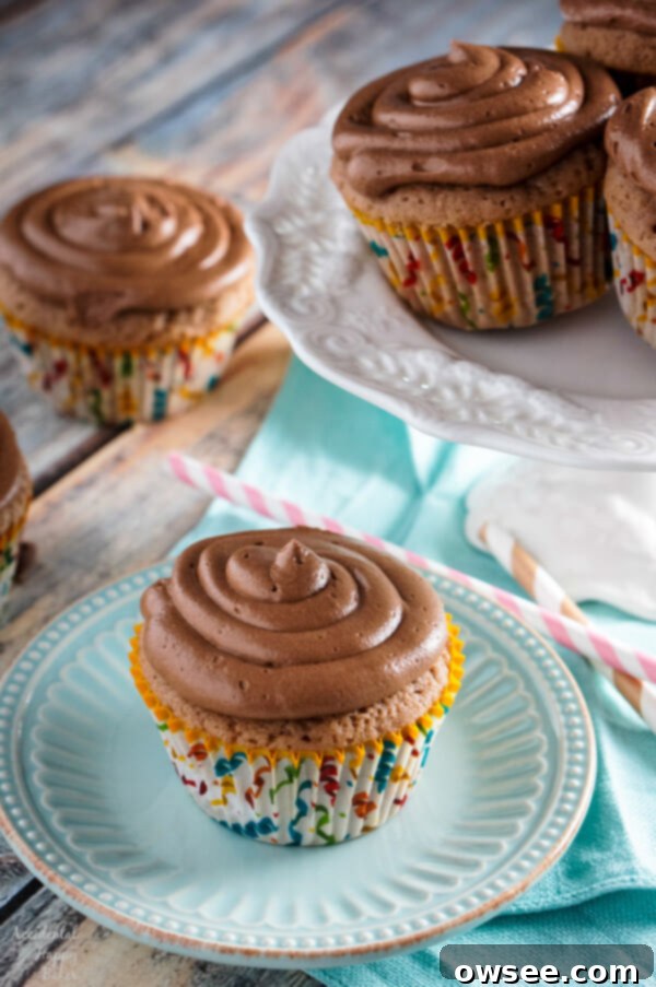 Soft and moist Spiced Nutella Cupcakes topped with creamy whipped Nutella frosting, ready to be enjoyed.