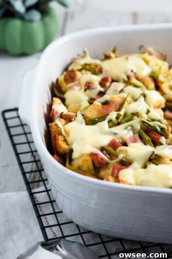 Layers of English muffins, ham, asparagus and cheese are drenched in eggs, Hollandaise mix and half and half for a hearty breakfast casserole that works great anytime of year. A perfect make-ahead dish for brunch or breakfast.