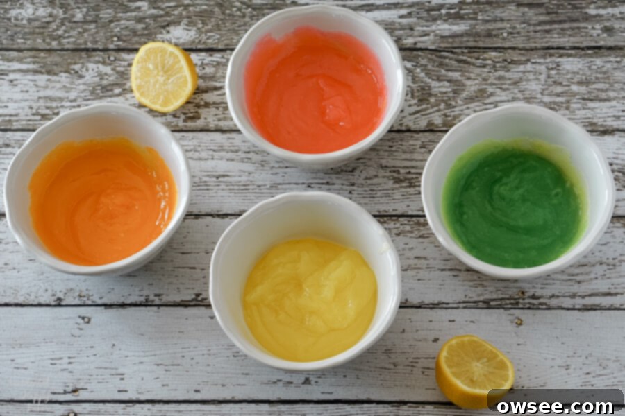 Food coloring is mixed into divided portions of the lemon meringue pie filling.