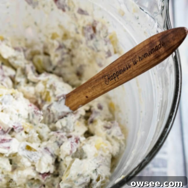 Close-up of Pickle Thing Dip, showing the creamy texture and bits of pickle.