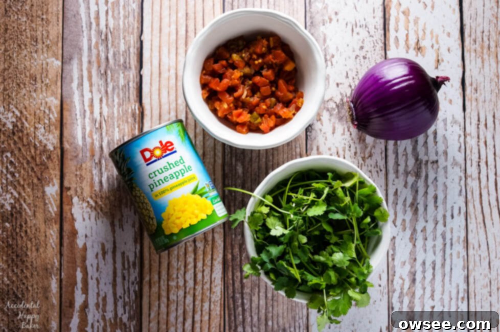 Ingredients for pineapple salsa: canned crushed pineapple, tomatoes and green chiles, red onion, and cilantro.