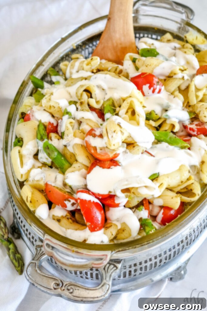Rich Pesto Pasta Delight 2 A vibrant bowl of creamy pesto pasta salad, garnished with fresh herbs and cherry tomatoes.
