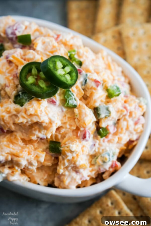Spicy Jalapeno Pimento Cheese 7 A bowl full of Jalapeno Pimento Cheese, perfect as a spicy appetizer or creamy spread.