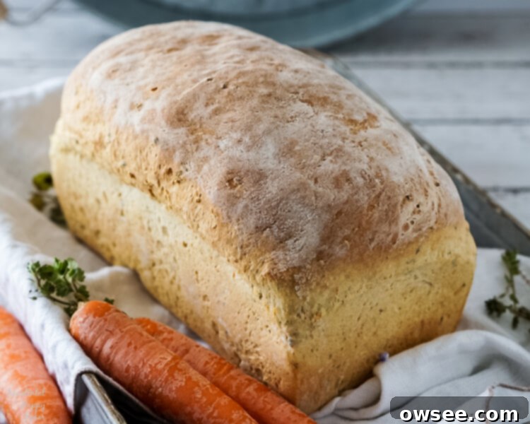 Savory Carrot Chive Loaf 8 A beautiful loaf of homemade carrot and chive bread, ready to be enjoyed.
