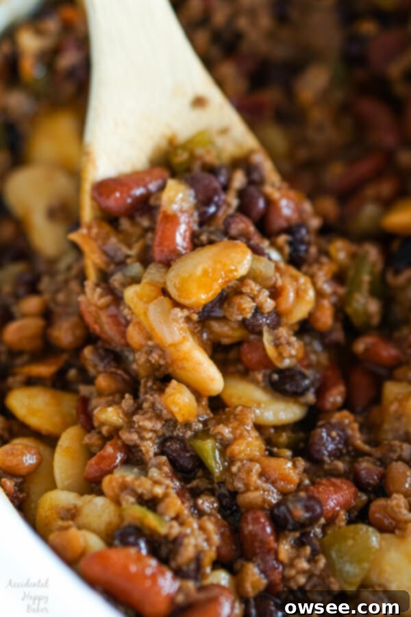 A top-down view of various canned beans, ready to be prepared for Slow Cooker Calico Beans.