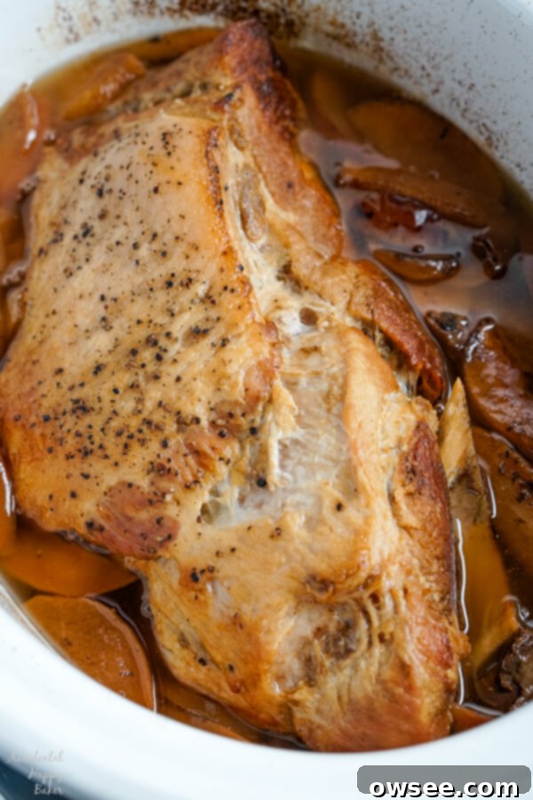 After slow braising for 7-8 hours on low heat, the Boston butt pork roast is beautifully golden brown and incredibly tender, ready to be shredded into perfect pulled pork.